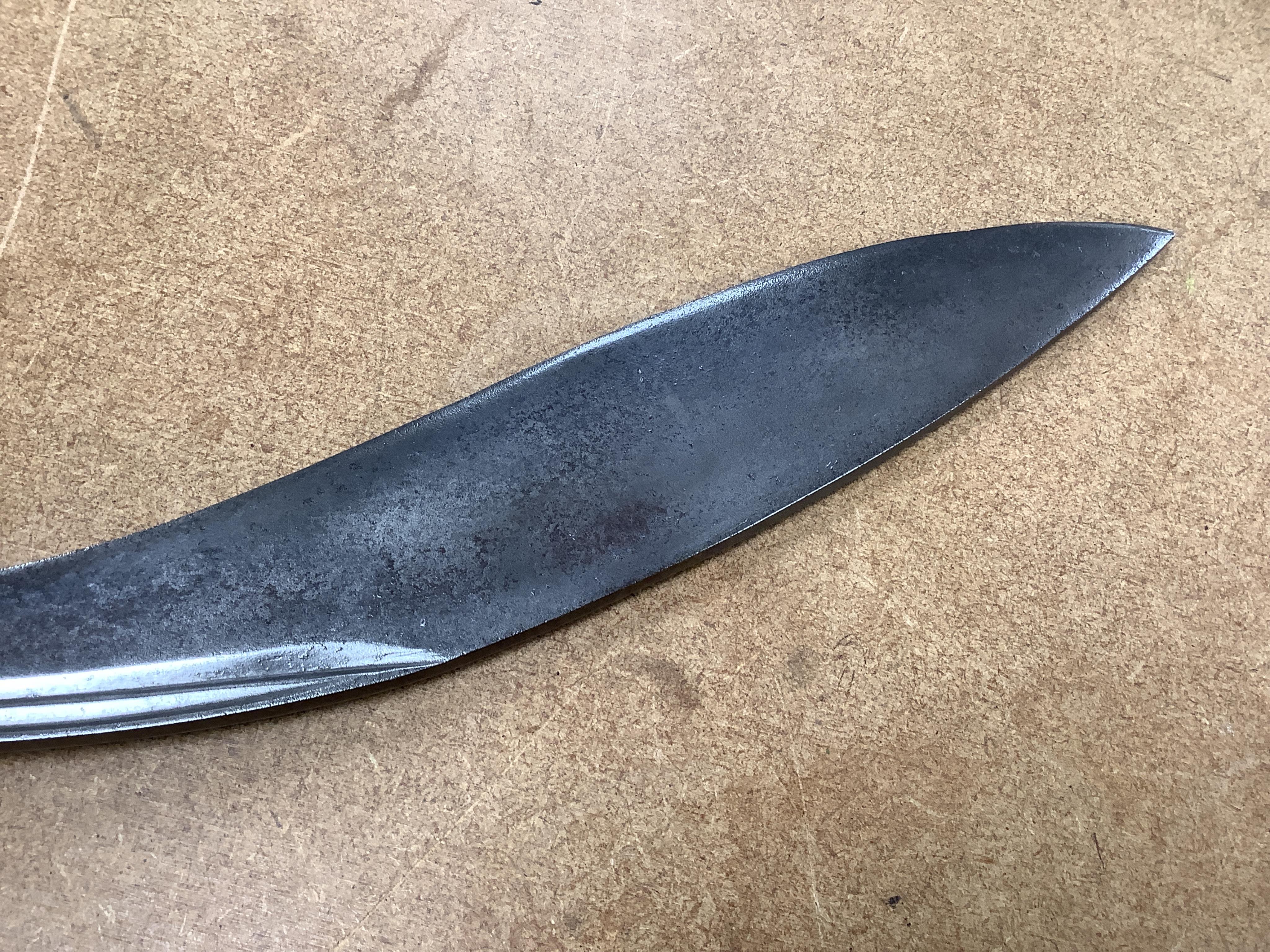 Four bladed weapons; an Indian sword Tulwar, blade 68.5cm. Condition - poor, heavily pitted., A Nepalese Kukri. Condition - fair., A Thai sword Dha, with a lacquered hilt and wooden scabbard, blade 56cm. Condition - fair